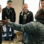 Camico Rivon, Kent Food Bank assistant director, describes employee-to-customer operations to the Amazon Kent fulfillment centers visiting senior team that includes, from left, General Manager Sally Smith, Derek Rubino, Aaron Kilgore and Nate Carr. MARK KLAAS, Kent Reporter