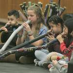 Fifth- and sixth-graders from Emerald Park Elementary Schools Terra Musica group perform a song on their created didgeridoos at the Kent Kids Arts Day program on Saturday. MARK KLAAS, Kent Reporter