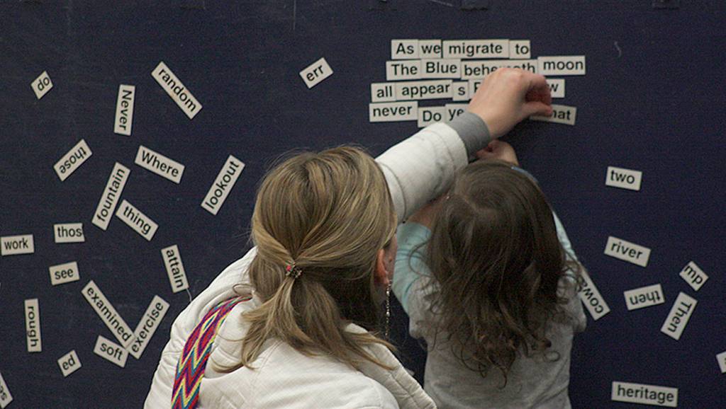 Mom and daughter team up for some magnetic poetry on the Wall of Words. MARK KLAAS, Kent Reporter