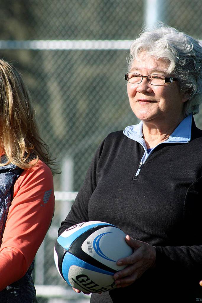 Kids take to the new synthetic soccer field surface during the grand reopening of Hogan Park at Russell Road last Saturday. MARK KLAAS, Kent Reporter
