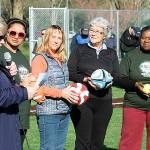 As Mayor Dana Ralph speaks, City Council members, from left, Satwinder Kaur, Toni Troutner, Suzette Cooke (former mayor) and Brenda Fincher listen during the grand reopening ceremony at Hogan Park. MARK KLAAS, Kent Reporter