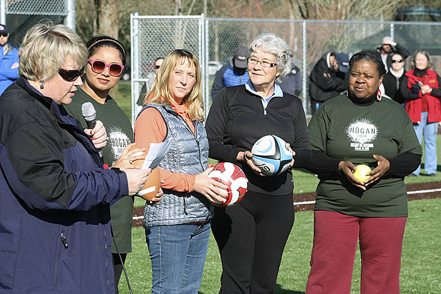 As Mayor Dana Ralph speaks, City Council members, from left, Satwinder Kaur, Toni Troutner, Suzette Cooke (former mayor) and Brenda Fincher listen during the grand reopening ceremony at Hogan Park. MARK KLAAS, Kent Reporter