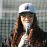 Kent Parks Director Julie Parascondola addresses the crowd during an on-field ceremony, ushering in the new synthetic surface at Hogan Park last Saturday. MARK KLAAS, Kent Reporter