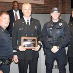 Firefighter Jim Blatt receives the Chiefs Award for Valor from Kent Police Chief Ken Thomas joined by Officer Andrew Reed and Fire Chief Matt Morris. COURTESY PHOTO, Kent Police