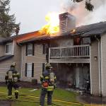 Firefighters battle a blaze on Friday, March 23, at the Island Park Apartment Homes in the Kent Valley. COURTESY PHOTO, Puget Sound Fire