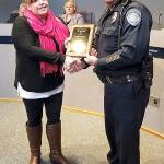 Karen Wesson receives the Kent Police 2017 Civilian Employee of the Year award from Chief Ken Thomas at the March 20 City Council meeting. COURTESY PHOTO, Kent Police