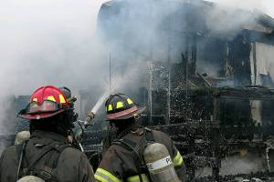 Firefighters extinguish SeaTac mobile home fire; woman found dead inside