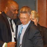 Doug Levy, right, receives a hug from Kent City Council President Bill Boyce as Mayor Dana Ralph looks on. City leaders honored Levy Tuesday night at City Hall for his 19 years as the paid lobbyist in Olympia for Kent. Levy decided to end his contract with the city as he changes up his work schedule to represent fewer cities. STEVE HUNTER, Kent Reporter