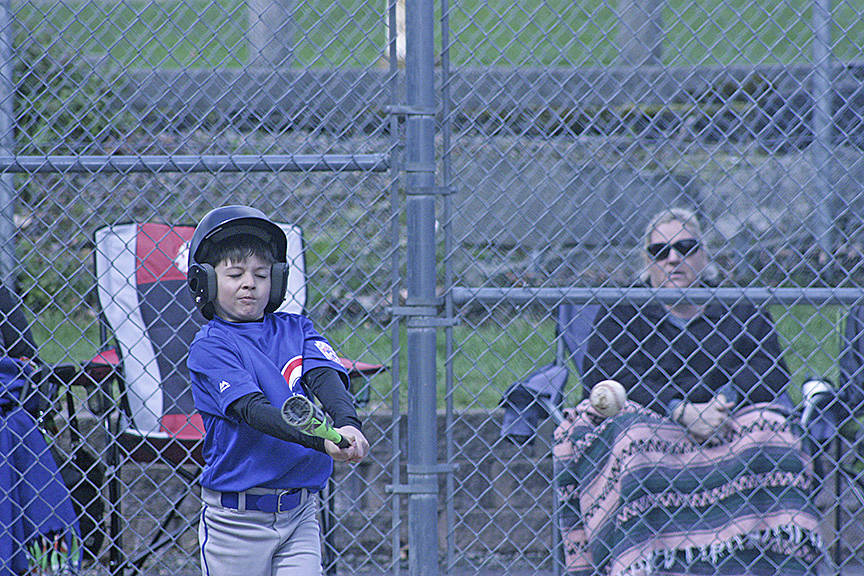 Spencer Carter connects on a two-run double in the Cubs AA battle against the Athletics. MARK KLAAS, Kent Reporter