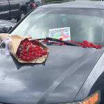 Someone left roses and a message on a car parked Tuesday, May 1 at the Kent Station shopping center parking lot. Kent Station posted the photo on its Facebook page, but the mystery remains. COURTESY PHOTO