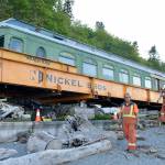 Nickel Bros workers move the parlor car from its shelter to the ship which will carry it across the water. Courtesy Photo