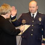 Kent Mayor Dana Ralph swears in new Police Chief Rafael Padilla on Tuesday night at City Hall. STEVE HUNTER, Kent Reporter