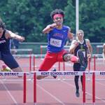 Todd Beamers Kobe Okezie, left, tries to catch Kent-Meridians Alex McGeachy in the 300-meter intermediate hurdles final at the 4A West Central District track and field championships at French Field last Saturday. Okezie edged McGeachy for the win. MARK KLAAS, Kent Reporter