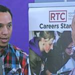 Anthony Covington, director of outreach and entry services at Renton Technical College, talks to an inquirer during a career fair at the Birch Creek Youth Center. MARK KLAAS, Kent Reporter