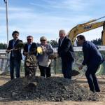 Developers Jonathan Manheim, far left, John McKenna, Brett Jacobsen and Charles Strazzara join Kent Mayor Dana Ralph, center, to break ground Thursday, May 24, on the Marquee on Meeker mixed-use project on the former par 3 golf course property. COURTESY PHOTO