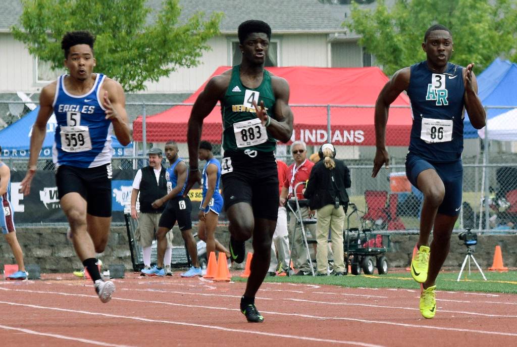 Kentridges Solomon Hines, middle, races Auburn Riversides Jaden Robinson, right, and Federal Ways Anthony Frazier, left, in the 100-meter dash at the 4A track and field championship last weekend. Hines took second in the 100 at 10.95 seconds. RACHEL CIAMPI, Reporter