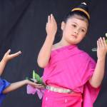 Young performers from the Kinnaly Lao Traditional Music Dance Troupe move to song on the Plaza Stage during the 10th annual Kent International Festival last Saturday. MARK KLAAS, Kent Reporter