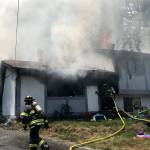 Firefighters work to control a Kent house fire Tuesday. COURTESY PHOTO, Puget Sound Fire