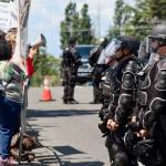 Police keep an eye on pro-choice demonstrators lined along Southeast 240th Street. MARK KLAAS, Kent Reporter