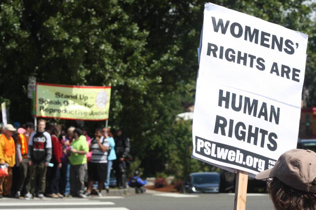 Opposite sides of the demonstration. MARK KLAAS, Kent Reporter