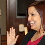 Marli Larimer smiles as she takes the oath of office as a Kent City Council member Tuesday night. Larimer was appointed to the council, filling a vacancy by the departure of Tina Budell. STEVE HUNTER, Kent Reporter