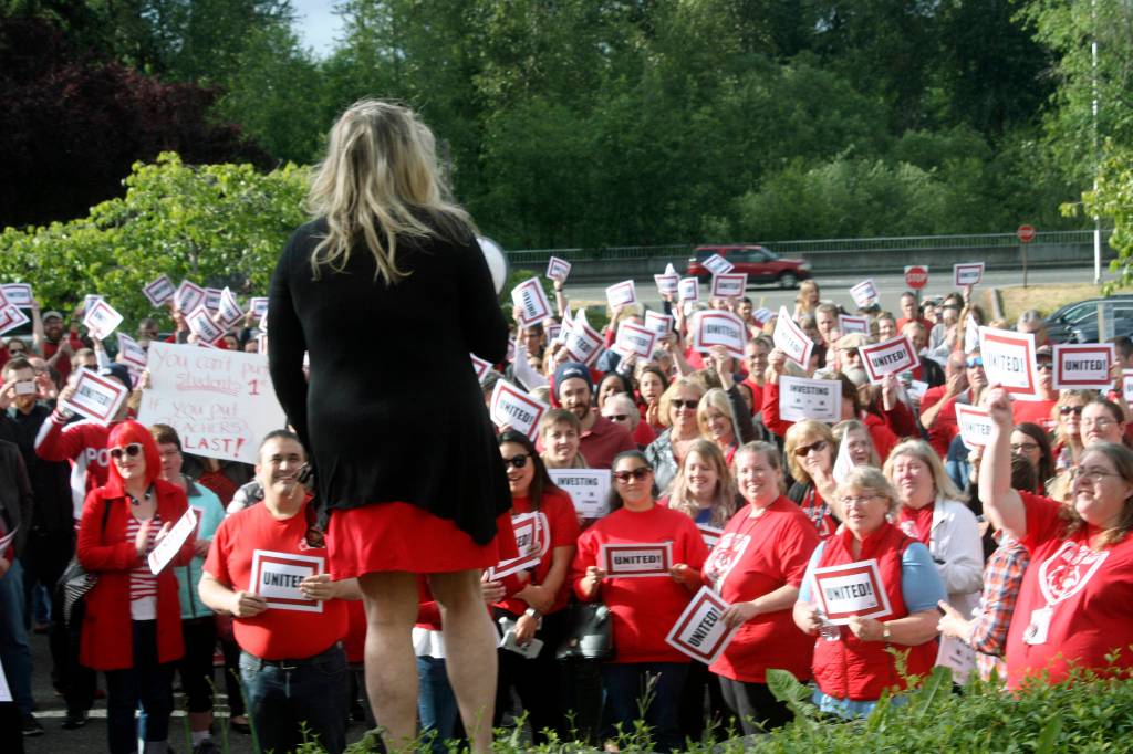 Christie Padilla, president of the Kent Education Association, and teachers gather in a rally for better pay. MARK KLAAS, Kent Reporter