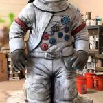 Todd Lehman, of Cre8play, stands behind the astronaut he helped design for a planned lunar rover display in Kent. The astronaut will have a removable face shield. The astronaut will soon go on display at the accesso ShoWare Center to help raise funds for the lunar replica display at a downtown park. COURTESY PHOTO