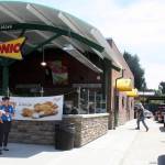 Sonic Drive-In employees Rachael Townsend, left, and Amy Hemstead stand ready as customers fill the drive-thru lane at Kents new Sonic restaurant on Monday. MARK KLAAS, Kent Reporter