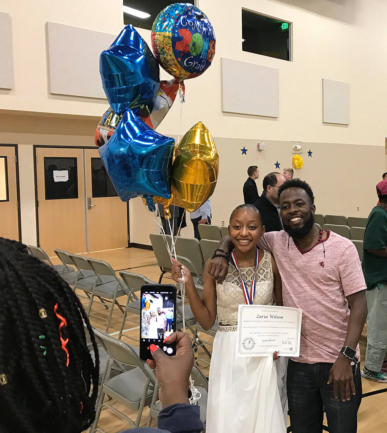 Zaria Wilson celebrates her eighth-grade graduation June 13 from Kents Excel Public Charter School. It marks the first graduation class for the school with students who started in the sixth grade. COURTESY PHOTO, Excel Public Charter School