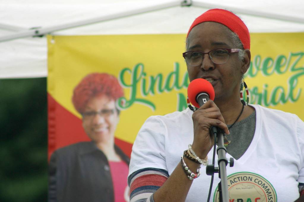 Gwen Allen-Carston, executive director of Kent Black Action Commission, welcomes the audience to the Juneteenth Festival and Celebration at Morrill Meadows Park last Saturday. The event was held in memory of the late Linda Sweezer, a KBAC member. MARK KLAAS, Kent Reporter