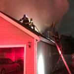 Firefighters tackle a house fire early Thursday morning in the 13300 block of Southeast 263rd Place. COURTESY PHOTO, Puget Sound Fire