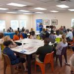 People listen to details about the expanded services during an open house in June at the Community Engagement Center in downtown Kent to serve the homeless. COURTESY PHOTO, Catholic Community Services