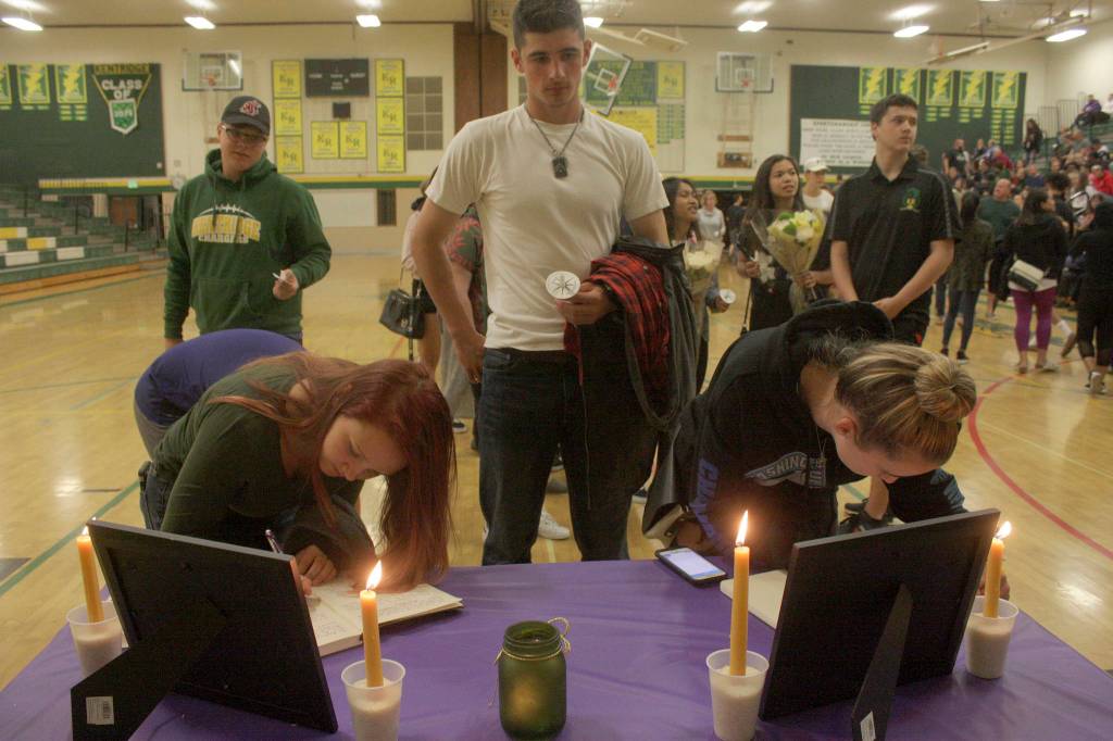 Students and supporters line up in the gym to sign memorial books to honor Eric Anderson, Kentridges athletic director who passed away Saturday. MARK KLAAS, Kent Reporter