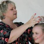 Mayor Dana Ralph places the crown on 2018 Miss Cornucopia Jessica Plett at the coronation Friday afternoon in the Town Square Plaza. MARK KLAAS, Kent Reporter