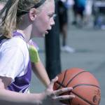 Lucy Larson of the JDL Ballers drives on the Hornets in seventh-grade girls action. MARK KLAAS, Kent Reporter