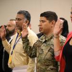 Pvt. 1st Class Aquiles R. Morales Centeno of Headquarters and Headquarters Company, 3rd Battalion, 161st Infantry Regiment, 81st Stryker Brigade Combat Team, recites the Naturalization Oath of Allegiance to the United States of America to become a naturalized citizen of the U.S. July 17 in Tukwila. Pfc. Morales is a native of Nicaragua but joined the Washington National Guard with the goal of earning his college degree. COURTESY PHOTO, U.S. Army National Guard, Sgt. 1st Class Jason Kriess.