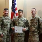 Pvt. 1st Class Aquiles R. Morales Centeno, center, of Headquarters and Headquarters Company, 3rd Battalion, 161st Infantry Regiment, 81st Stryker Brigade Combat Team, poses for a photo with his company commander, Capt. Jordan Villeneuve, left, and his section leader, Staff Sgt. Jeremiah Olson after reciting the Naturalization Oath of Allegiance to the United States of America to become a naturalized citizen of the U.S. July 17, 2018 in Tukwila. Pfc. Morales is a native of Nicaragua but joined the Washington National Guard with the goal of earning his college degree. COURTESY PHOTO, U.S. Army National Guard, Sgt. 1st Class Jason Kriess.