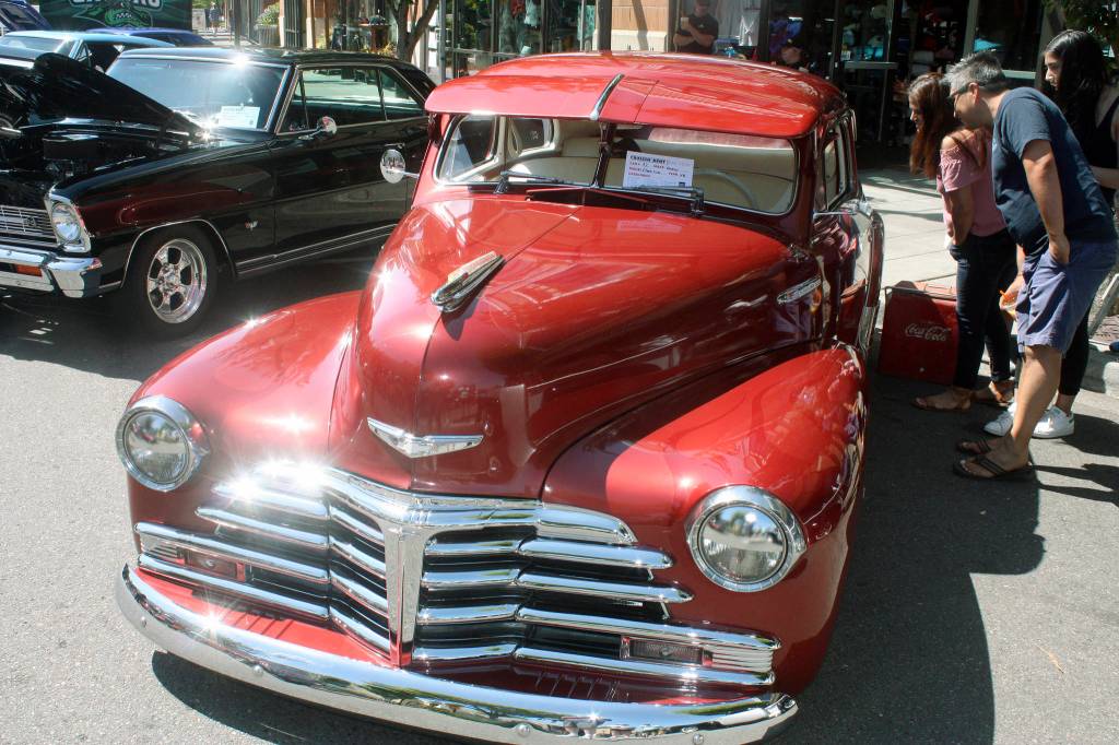 Above, a 1948 Fleet Line Chevrolet captures the attention of curious onlookers at the show. Below, a 1939 Chevrolet sparkles in the sunshine at Kent Station. MARK KLAAS, Kent Reporter