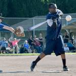 Above, Dylan Pleasants from Seattle South King Sluggers fields the ball during action against a team from the city of Kent last Sunday at Hogan Park. Below, Michael Walker from Seattle South King Sluggers gets a hit. RACHEL CIAMPI, Kent Reporter