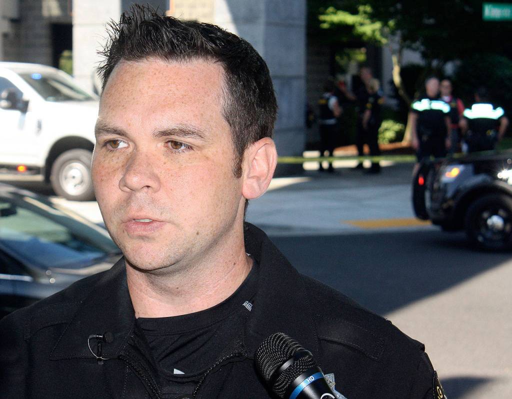 Sgt. Ryan Abbott, King County Sheriffs Office spokesman, updates the media outside of the Kent Station parking garage where a deputy shot and killed a suspect in a stolen vehicle. STEVE HUNTER, Kent Reporter