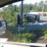 Kent Police investigate the scene of a crash that killed a pedestrian on Pacific Highway South. The driver of the vehicle who struck the pedestrian also hit a tree and another car before landing on its side. COURTESY PHOTO