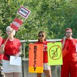 Kent teachers rally for better pay along Southeast 256th Street last Thursday, Aug. 9. The teachers union and the school district have yet to settle the dispute over salaries. MARK KLAAS, Kent Reporter