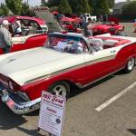 A classic 1957 Ford Fairlane convertible, powered by a 351 cubic-inch Windsor, stands out in the lineup as its owner, Kents Rick Gould talks to passers-by.