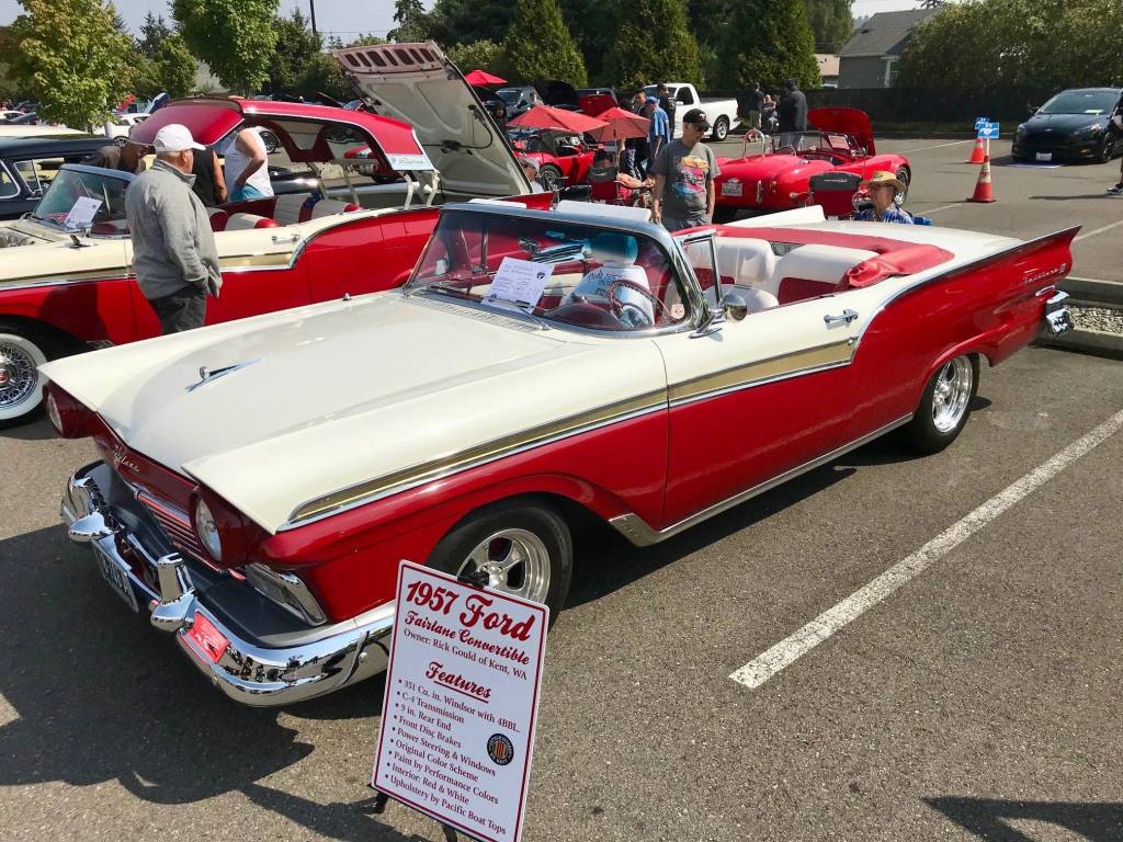 A classic 1957 Ford Fairlane convertible, powered by a 351 cubic-inch Windsor, stands out in the lineup as its owner, Kents Rick Gould talks to passers-by.