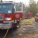 Firefighters work to douse brush fire near Highway 18