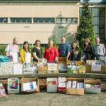 Mayor Dana Ralph joins city employees in delivering school supplies at Kent-Meridian High School on Tuesday. COURTESY PHOTO