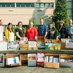 City employees donate school supplies, cash to Kent-Meridian High School