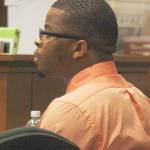 Marty Kime sits in court Monday at the Maleng Regional Justice Center in Kent at his murder trial for allegedly fatally shooting 1-year-old Malijah Grant in April 2015 in Kent. STEVE HUNTER, Kent Reporter