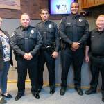 Kent Mayor Dana Ralph, far left, and Assistant Chief Derek Kammerzell, far right, pose with new Kent Police Officers Justin Campbell, second from left, Brandon Hamilton and Kelly Robinson after their swearing in ceremony Sept. 18 at City Hall. COURTESY PHOTO, City of Kent