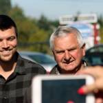 Larry Person, right, and his nephew, David ONeal, appear at an award-recognition ceremony outside Reber Ranch on Sept. 26. Person and ONeal operate Sidetrack Distillery, a finalist for the King County Rural Small Business of the Year award. MARK KLAAS, Kent Reporter